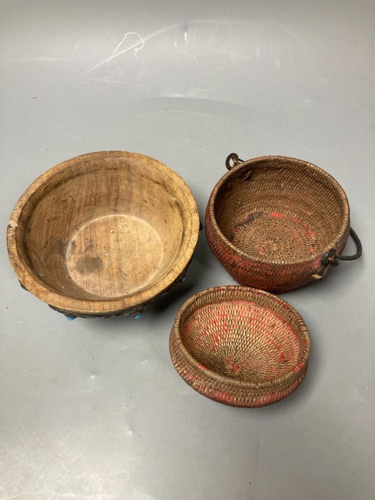 A Tibetan wooden bowl, diameter 13cm and a woven lidded basket